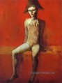 Arlequin assis sur un canapé rouge 1905 Pablo Picasso